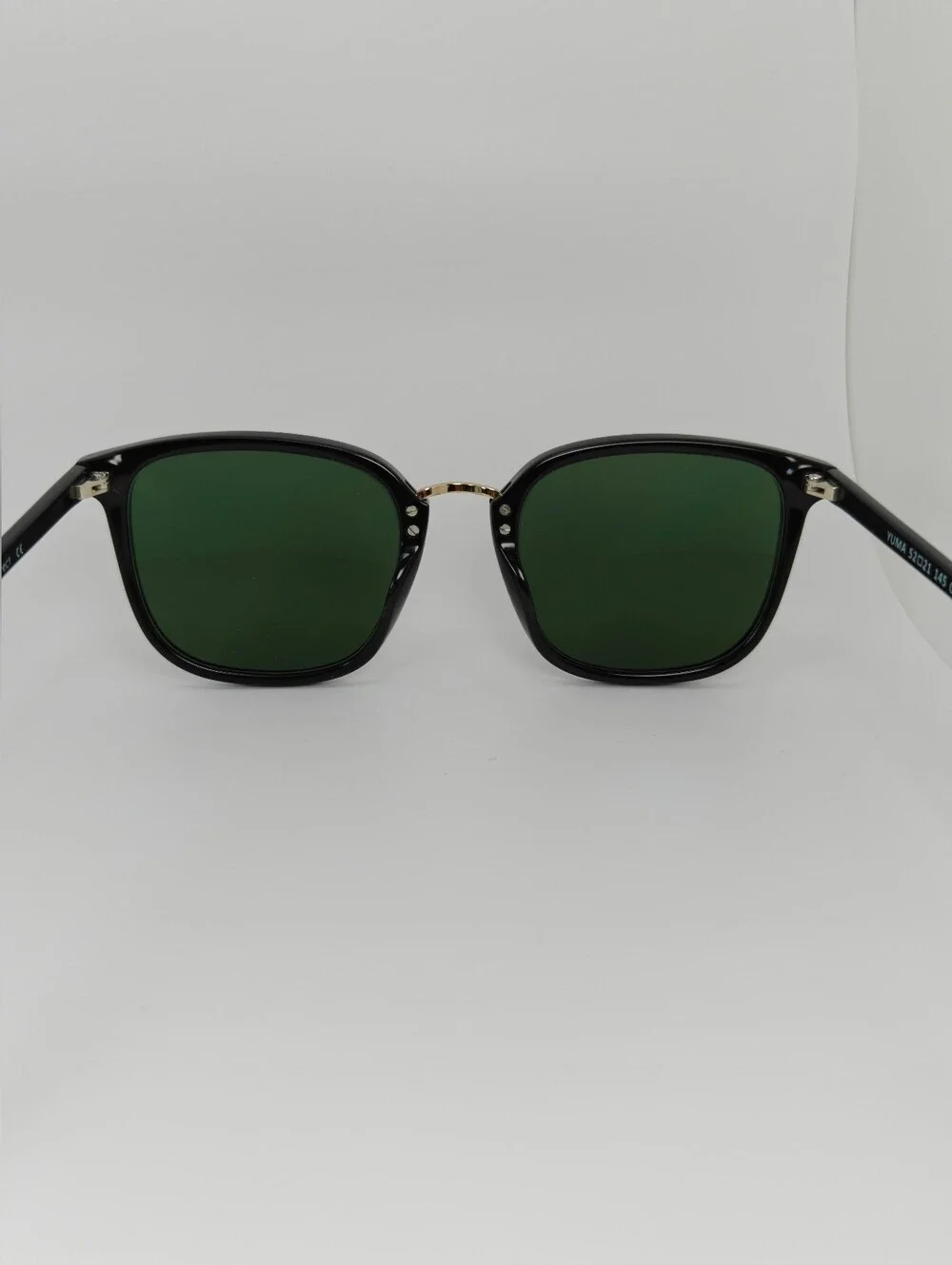 Yuma. Classic Black Frame Gold Bridge. Subtle Lines Rounded Square Frame..